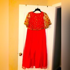 Indian girl peach colored embroidered gown